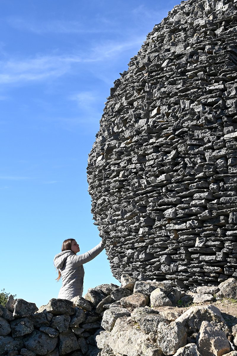 atelier yokyok sculpts sphere land installation out of black schist and granite in portugal